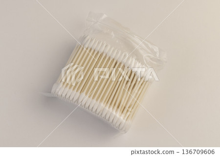 cotton swabs made of natural cotton and sticks made of recycled paper, sticks with pieces of natural cotton wool for personal hygiene and facial care and makeup 136709606