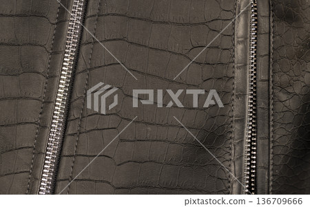 black artificial fabric in the style of crocodile skin with specks and spots , close up black artificial fabric in the style of crocodile skin with specks and spots , close up 136709666