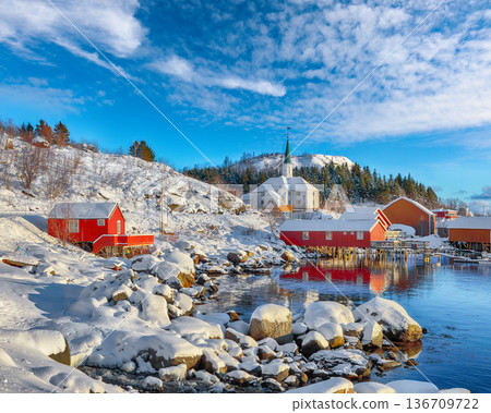 Outstanding winter scenery of Moskenes village with ferryport and famous Moskenes parish Church. Outstanding winter scenery of Moskenes village with ferryport and famous Moskenes parish Church. 136709722