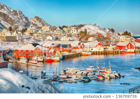 Captivating snowy morning cityscape of Sorvagen town and port. Captivating snowy morning cityscape of Sorvagen town and port. 136709739