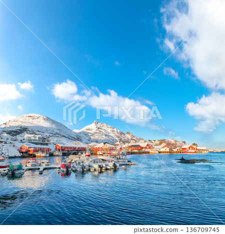 Captivating snowy morning cityscape of Sorvagen town and port. Captivating snowy morning cityscape of Sorvagen town and port. 136709745