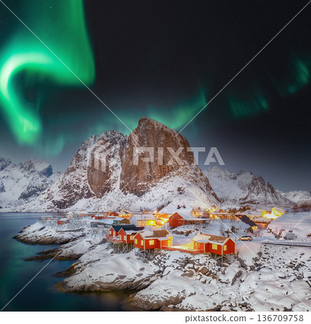 Breathtaking winter view on Hamnoy village at night with Northern lights (Aurora Borealis). 136709758