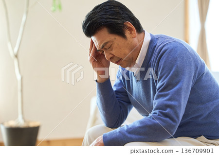Senior Asian man worried in his room Senior Asian man worried in his room 136709901