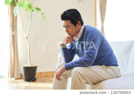 Senior Asian man worried in his room Senior Asian man worried in his room 136709903