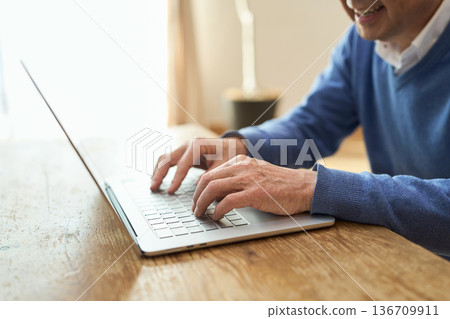 Hands of an Asian senior man conversing with AI Hands of an Asian senior man conversing with AI 136709911