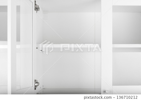 White cupboard with open door 136710212