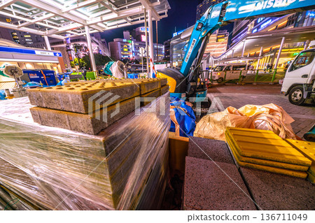 Yokohama cityscape, Japan, February 18th. Repair work is underway on the damaged sidewalk at the west exit of Yokohama Station. Materials and heavy machinery are lined up... Hazardous materials... Yokohama cityscape, Japan, February 18th. Repair work is underway on the damaged sidewalk at the west exit of Yokohama Station. Materials and heavy machinery are lined up... Hazardous materials... 136711049