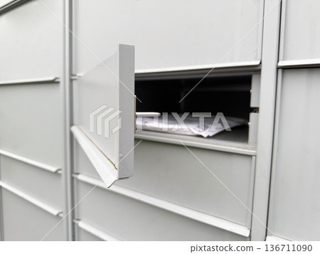 Modern mailbox system receiving online shopping parcel. 136711090