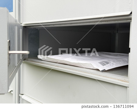 Modern mailbox system receiving online shopping parcel. 136711094