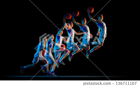 Basketball player slam dunk sequence in stroboscopic effect. Basketball player slam dunk sequence in stroboscopic effect. 136711107