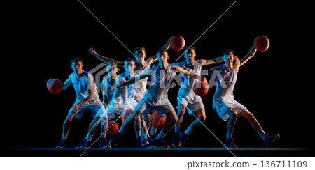 Motion sequence basketball player defensive stance in dark studio. Motion sequence basketball player defensive stance in dark studio. 136711109