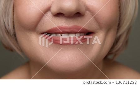 Close up mature woman lips natural lipstick detail 136711258