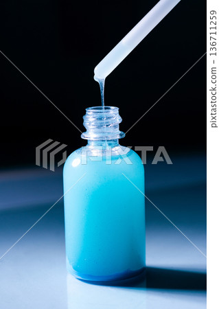 Blue Copper peptides skin repairing serum in transparent bottle. Face and skin beauty routine themes 136711259