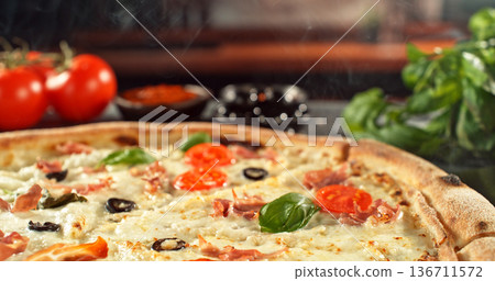 Closeup of a freshly baked pizza with melted cheese and golden crust in warm, appetizing light. Classic comfort food concept with rich texture and inviting presentation. Closeup of a freshly baked pizza with melted cheese and golden crust in warm, appetizing light. Classic comfort food concept with rich texture and inviting presentation. 136711572
