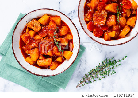 meat goulash with potatoes and carrots, sweet peppers, in a saucepan, top view, traditional Hungarian soup, homemade, no people, meat goulash with potatoes and carrots, sweet peppers, in a saucepan, top view, traditional Hungarian soup, homemade, no people, 136711934