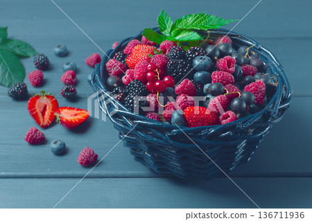 mix of fresh berries, in a basket, on a wooden gray table, no people, top view, mix of fresh berries, in a basket, on a wooden gray table, no people, top view, 136711936