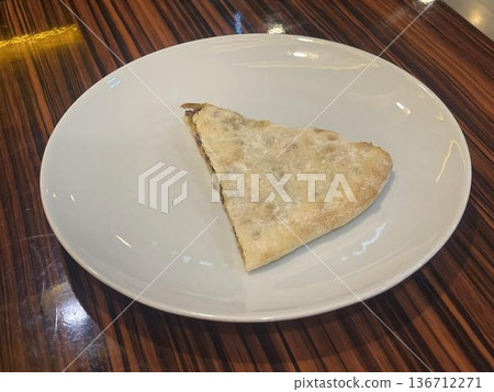 slice of cubdari on the plate. georgian food slice of cubdari on the plate. georgian food 136712271