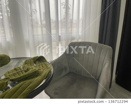 Cozy Knitting Scene by Window with Armchair 136712294