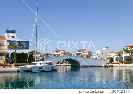 Catamaran moored at the bridge connecting the Island Villas to Limassol Marina Catamaran moored at the bridge connecting the Island Villas to Limassol Marina 136712353