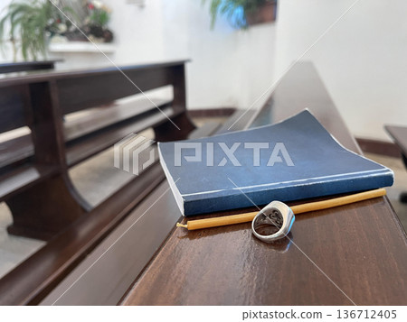 christian catholic ring with bible on the wooden bench for pray christian catholic ring with bible on the wooden bench for pray 136712405