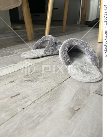 Cozy Slippers on Wooden Floor at Home Cozy Slippers on Wooden Floor at Home 136712414
