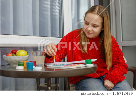Happy kid drawing. Cute child at home Happy kid drawing. Cute child at home 136712459