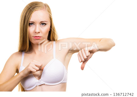 Woman dissatisfied with size of bra breasts Woman dissatisfied with size of bra breasts 136712742