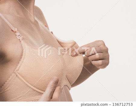 Girl wearing too big bra cup Girl wearing too big bra cup 136712753