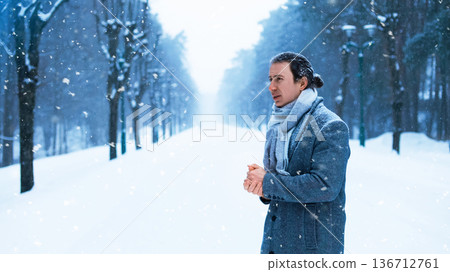 Depressed man shivering and rubbing his hands in a freezing winter park. He stands alone in a snowy alley facing worsening weather, heavy blizzard, and seasonal sadness. High quality photo Depressed man shivering and rubbing his hands in a freezing winter park. He stands alone in a snowy alley facing worsening weather, heavy blizzard, and seasonal sadness. High quality photo 136712761