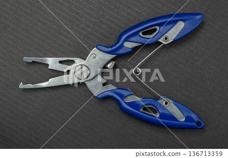 Fishing multitool close-up Fishing multitool close-up 136713359