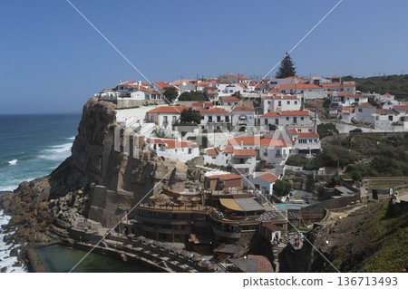 Traditional white village of Azenhas do Mar perched on a cliff, Portugal. Traditional white village of Azenhas do Mar perched on a cliff, Portugal. 136713493