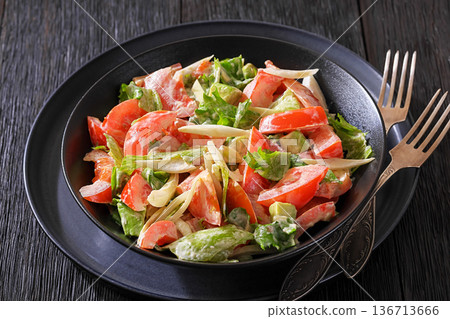 Avocado tomato salad with lettuce and mayonnaise Avocado tomato salad with lettuce and mayonnaise 136713666