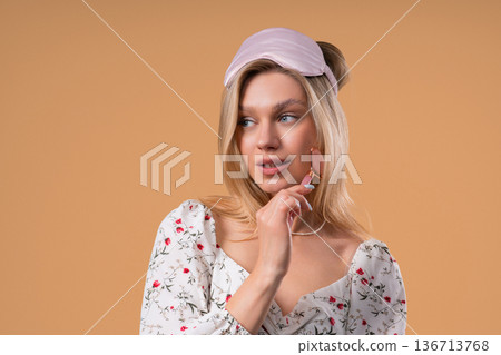 Charming Woman Doing Face Massage With Rose Quartz Stone Roller For Firmer 136713768