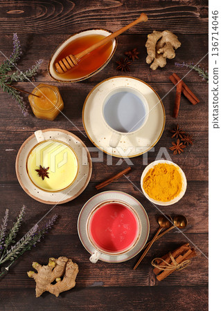 Selection of colorful varieties of matcha latte, Japanese tea, golden turmeric, lavender blue, pink moon milk. This trendy, healthy drink promotes weight loss,has anti inflammatory properties Selection of colorful varieties of matcha latte, Japanese tea, golden turmeric, lavender blue, pink moon milk. This trendy, healthy drink promotes weight loss,has anti inflammatory properties 136714046