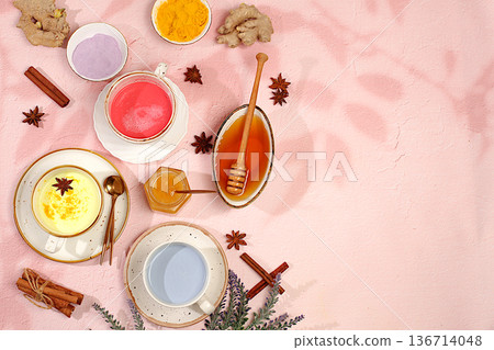 Variety of colorful matcha latte, Japanese tea, golden turmeric, lavender blue and pink moon milk,trendy healthy drink promotes weight loss,relaxing drink before bed, has anti inflammatory properties 136714048