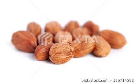 Hazelnuts kernels on a white background, healthy food. Macro Hazelnuts kernels on a white background, healthy food. Macro 136714598