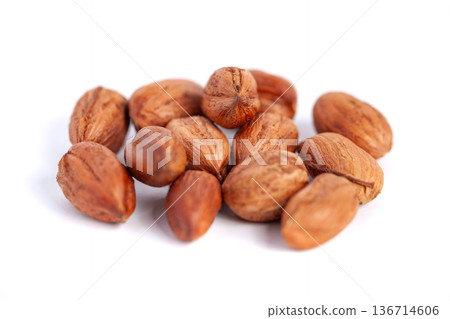Hazelnuts kernels on a white background, healthy food. Macro Hazelnuts kernels on a white background, healthy food. Macro 136714606