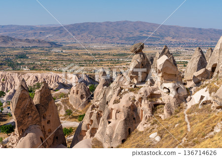 Volcanic rock formations landscape in Cappadocia, place of residence of ancient Christians 136714626