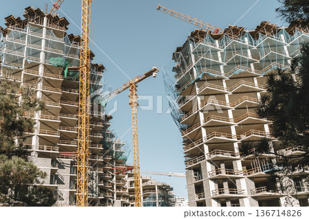 Construction of a building. Construction site with crane. Business, development, industry. Construction of a building. Construction site with crane. Business, development, industry. 136714826