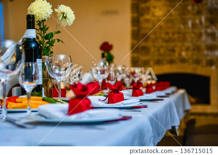 Festive table setting with bread and wine glasses Festive table setting with bread and wine glasses 136715015