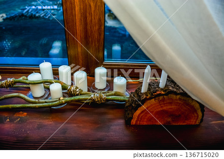 Rustic candle arrangement on wooden window sill Rustic candle arrangement on wooden window sill 136715020