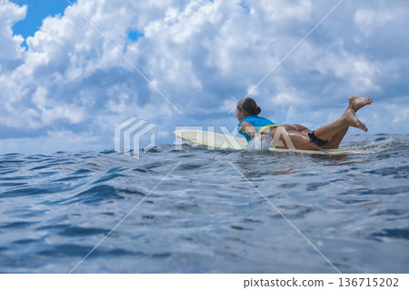 Youthful Woman Demonstrating Paddling Ability Youthful Woman Demonstrating Paddling Ability 136715202