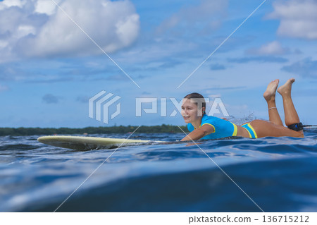 Young Woman In Casual Attire Paddling And Smiling During Beach Holiday Shoot Young Woman In Casual Attire Paddling And Smiling During Beach Holiday Shoot 136715212