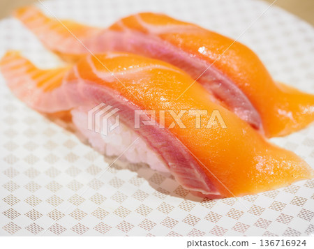 Salmon nigiri sushi at a conveyor belt sushi restaurant 136716924