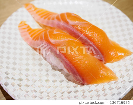 Salmon nigiri sushi at a conveyor belt sushi restaurant 136716925