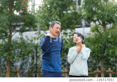 Men and women exercising Men and women exercising 136717051
