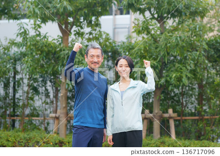 Men and women exercising 136717096