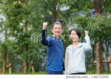 Men and women exercising Men and women exercising 136717099