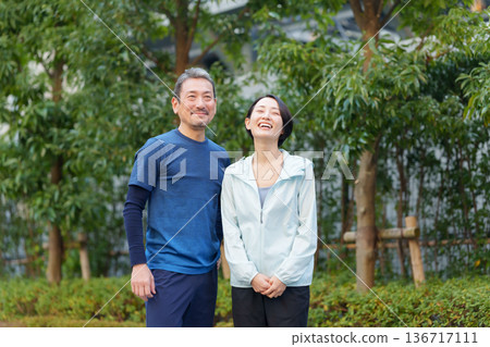 Men and women exercising 136717111