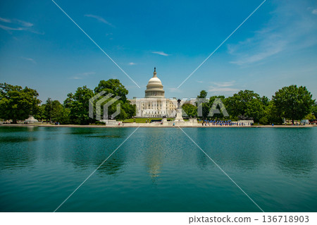 The Capitol. Washington, DC landmark. American flag above the Congress. Washington DC skyline. Senate and House in Washington, DC. The Capitol. Washington, DC landmark. American flag above the Congress. Washington DC skyline. Senate and House in Washington, DC. 136718903